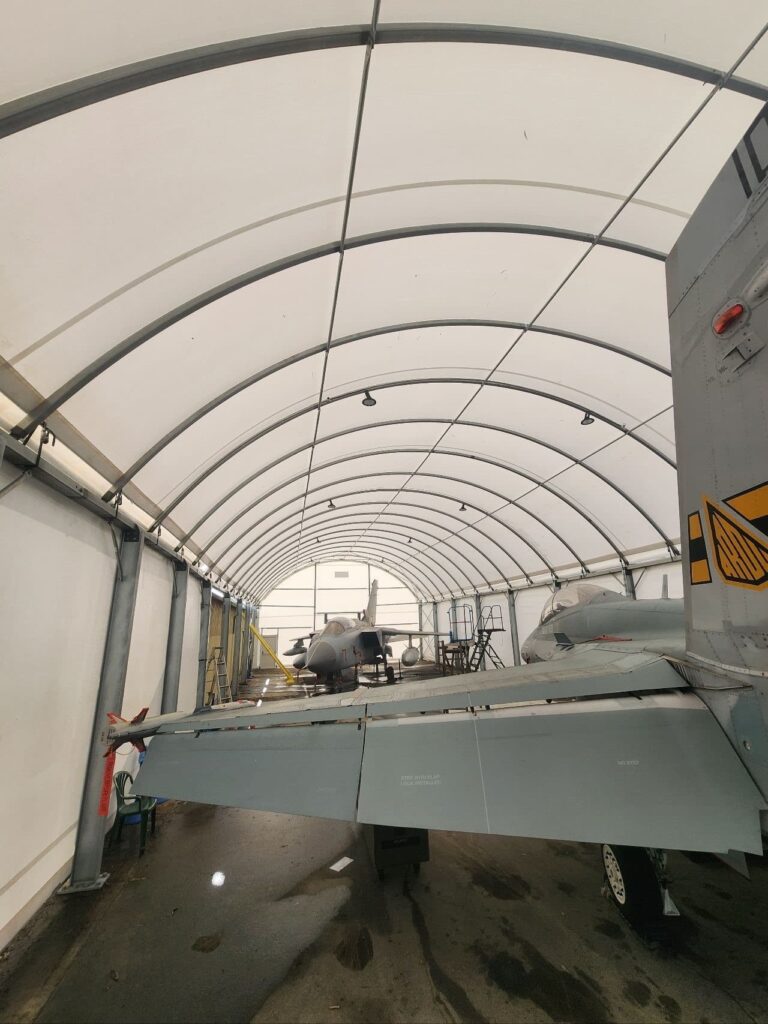An aircraft hangar containing two planes
